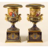 A PAIR OF VIENNA PORCELAIN GARNITURE URNS, late 19th century, the campana urns with gilt satyr