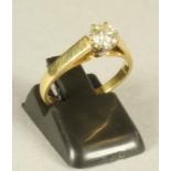 A SOLITAIRE DIAMOND RING, the brilliant cut stone of approximately 0.50cts claw set to a plain