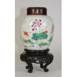 A CHINESE PORCELAIN JAR, 19th century, of typical form, painted in polychrome enamels with exotic