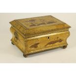 A REGENCY ENGLISH LACQUERED WORK BOX, c.1810, of sarcophagus form, painted in gilt and red with a