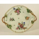 A FIRST PERIOD WORCESTER PORCELAIN DESSERT DISH, c.1770, of quatrefoil form with two twig handles,