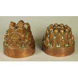 TWO VICTORIAN COPPER JELLY MOULDS, each of domed tapering cylindrical form, one castellated, the