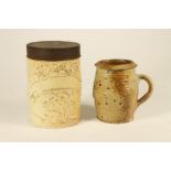 A STONEWARE MUG, possibly 16th century, of bombe cylindrical form in a partial glaze and with