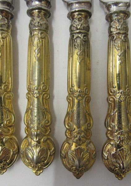 A SET OF TWENTY FOUR GOLD PLATED DESSERT KNIVES, c.1900, mainly Christofle with Gorham steel blades, - Image 2 of 3