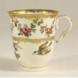 A VIENNA PORCELAIN COFFEE CUP, c.1790, painted in underglaze blue with two bands of scrolling