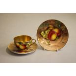 A ROYAL WORCESTER CHINA TRIO, various dates, all painted in polychrome enamels with a still life