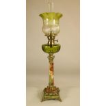 A BRASS MOUNTED ONYX OIL LAMP BASE, the slightly tapering octagonal onyx column with brass