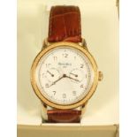 A GENTLEMAN'S GOLD PLATED RUSSIAN AUTOMATIC WRISTWATCH, the circular engraved champagne dial with