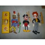 Three Pelham Puppets; 1960's (SL) Snake Charmer with green snake, yellow box, (SL) Mickey Mouse,