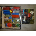 A quantity of Meccano parts, various colours, including wheels, several instruction books