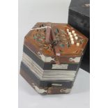 A GERMAN TWO ROW ANGLO CONCERTINA, early 20th century, with original star paper eight fold bellows