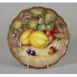 A ROYAL WORCESTER CHINA PLATE, 1952, of shaped circular form with gadroon moulded gilded rim,