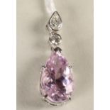 A PINK KUNZITE AND DIAMOND PENDANT, the pear shaped facet cut kunzite of 7.39cts claw set and