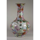 A CHINESE PORCELAIN VASE of baluster form, with shaped panels painted in famille rose enamels of