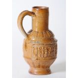 A GERMAN (RAEREN) SALTGLAZE STONEWARE BEER JUG, dated 1597, with tall ribbed neck, impressed