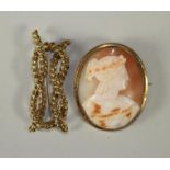 A VICTORIAN SHELL CAMEO BROOCH of oval form carved with the bust portrait of a young lady wearing