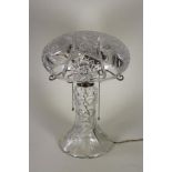 A GLASS TABLE LAMP BASE, c.1930's, the star and slice cut mushroom shade supported on three EPNS