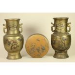 A PAIR OF JAPANESE BRONZE VASES, late 19th century, of baluster form with cast pierced handles,