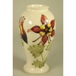 A MOORCROFT POTTERY VASE, 1983, of inverted baluster form, tubelined and painted in shades of