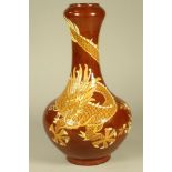 AN EARTHENWARE VASE, of baluster form with garlic neck