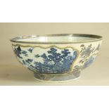 A CHINESE PORCELAIN BOWL, late 18th century, of plain circular form, moulded in relief with shaped