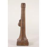 AN OAK TABLE LAMP BASE BY ROBERT THOMPSON, of swept square section with stiff leaf angles, carved