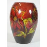 A MOORCROFT POTTERY FLAMBE VASE, c.1960, of rounded cylindrical form, tubelined and painted in