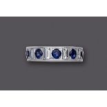 A SAPPHIRE AND DIAMOND HALF HOOP ETERNITY RING, the plain wide band bar set with five facet cut