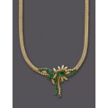 AN EMERALD AND DIAMOND NECKLACE, the 18kt gold herringbone link articulated necklace centred by a