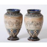 A PAIR OF DOULTON LAMBETH STONEWARE VASES, 1887, of rounded conical form with undulated rim, each