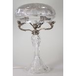 A TABLE LAMP BASE, early 20th century, the slice and flower cut mushroom shade supported on three