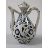 A CHINESE PORCELAIN SMALL WINE EWER AND COVER in Yuan style, of typical form, painted in
