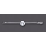 A DIAMOND SOLITAIRE BAR BROOCH, the brilliant cut stone of approximately 1.5cts, claw set to a white