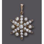 A DIAMOND STAR BROOCH/PENDANT, the central stone of approximately 0.20cts to six points each set