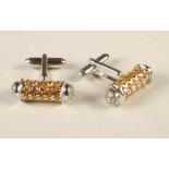 A PAIR OF YELLOW SAPPHIRE CUFFLINKS of barrel form, the circular facet cut stones alternately set in