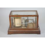 AN OAK CASED BAROGRAPH by Negretti & Zambra, London, c.1900, with clockwork drum and seven