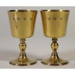 A PAIR OF SILVER GILT GOBLETS, makers Wakely & Wheeler, London 1970, the plain bucket bowls on