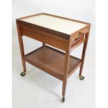 A SCANDINAVIAN DESIGN TEAK TEA TROLLEY, 1960's/70's, of oblong form with lift off reversible tray