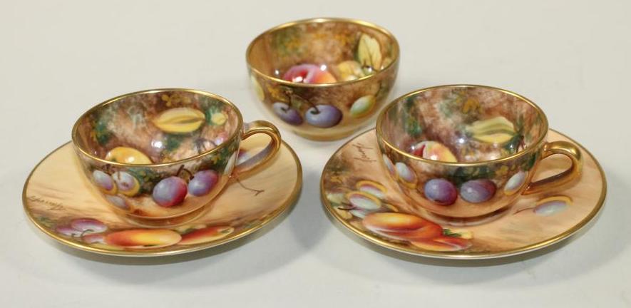 A PAIR OF ROYAL WORCESTER CHINA MINIATURE TEACUPS AND SAUCERS, modern, all over painted in - Image 2 of 2