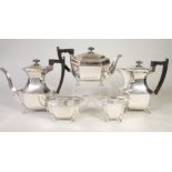 A SILVER FOUR PIECE TEA AND COFFEE SERVICE, maker Viners, Sheffield 1960, of canted oblong form