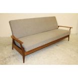 A SCANDINAVIAN DESIGN TEAK FRAMED SOFA BED, 1960's, upholstered in a speckled pale brown tweed,