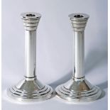 A PAIR OF SILVER CANDLESTICKS, makers Walker & Hall, Sheffield 1955, the fixed flared stepped