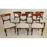 A SET OF SIX VICTORIAN MAHOGANY DINING CHAIRS, the waisted open back with arched top rail and