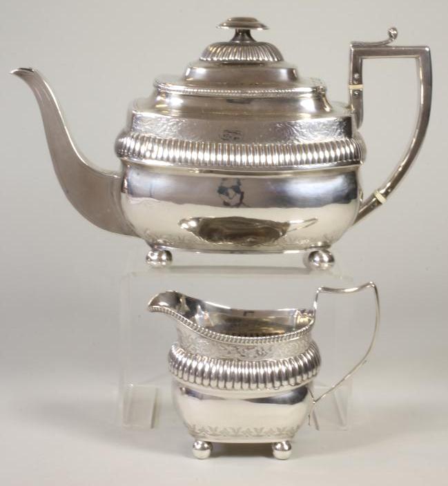 A LATE GEORGE III SILVER TEAPOT, maker's mark probably JH (script), London 1808, of rounded oblong
