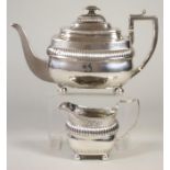 A LATE GEORGE III SILVER TEAPOT, maker's mark probably JH (script), London 1808, of rounded oblong