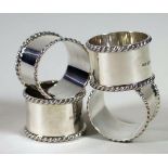 A SET OF FOUR SILVER NAPKIN RINGS, makers WAH, Birmingham 1973 (bi-centennial mark), the plain