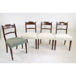 A SET OF FOUR GEORGE IV MAHOGANY DINING CHAIRS, c.1820, the panelled top rail with gadrooned crest