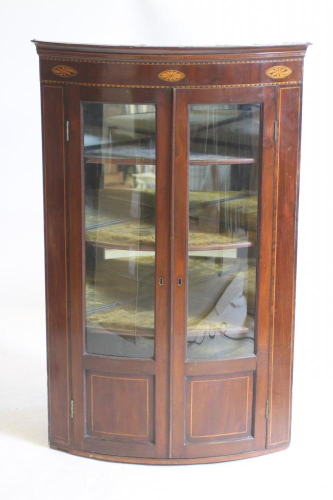 A GEORGIAN MAHOGANY CORNER CUPBOARD, late 18th century and later, the moulded cornice over chequer