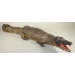 A STUFFED CROCODILE, late 19th/20th century, with painted red mouth interior and painted wood