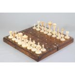 AN ANGLO INDIAN IVORY CHESS SET, late 19th century, all natural, one set with two turned and block